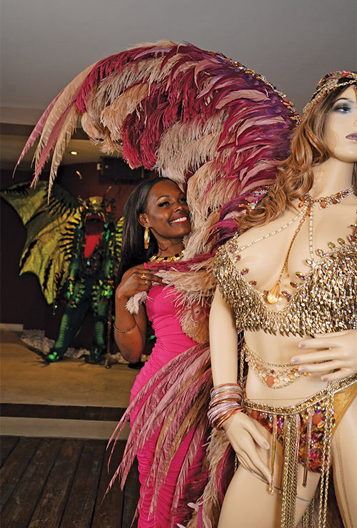 A visitor tries on a Carnival costume at the museum. The museum's creator, Gerald Hart, made his reputation as one of the islands' most prolific Carnival costume designers. A visitor tries on a Carnival costume at the museum. The museum's creator, Gerald Hart, made his reputation as one of the islands' most prolific Carnival costume designers.