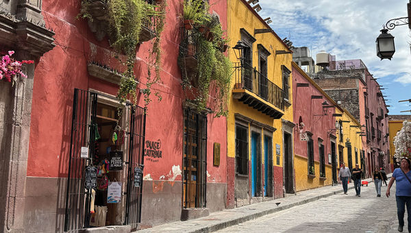 Colorfully painted homes and shops flank the cobblestone streets that wind throughout San Miguel de Allende. Colorfully painted homes and shops flank the cobblestone streets that wind throughout San Miguel de Allende.