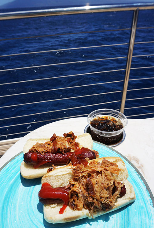 For lunch, the crew serves its famous big kahuna dog, a hot dog with kalua pork on top.