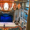 The atrium on the Disney Treasure features ornate lighting inspired by the movie "Aladdin."