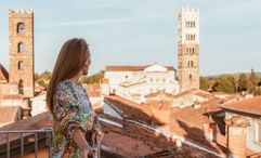A solo guest takes in a terrace view at the Grand Universe Lucca in Tuscany. In response to a large percentage of solo travelers in Italy, it launched an offer called Solo & Spritzing.