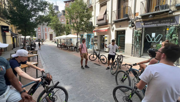 Pausing for a bit of local history on an e-bike tour in Madrid. Pausing for a bit of local history on an e-bike tour in Madrid.