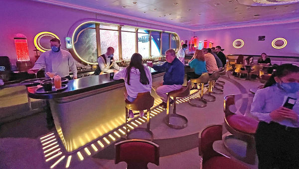 The adults-only Star Wars: Hyperspace Lounge has a “window” behind the bar that offers views of planets and ships from the Star Wars universe. The adults-only Star Wars: Hyperspace Lounge has a “window” behind the bar that offers views of planets and ships from the Star Wars universe.