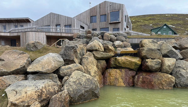 The geothermal baths at Highland Base, with the hotel's main restaurant and lounge in the background. The geothermal baths at Highland Base, with the hotel's main restaurant and lounge in the background.